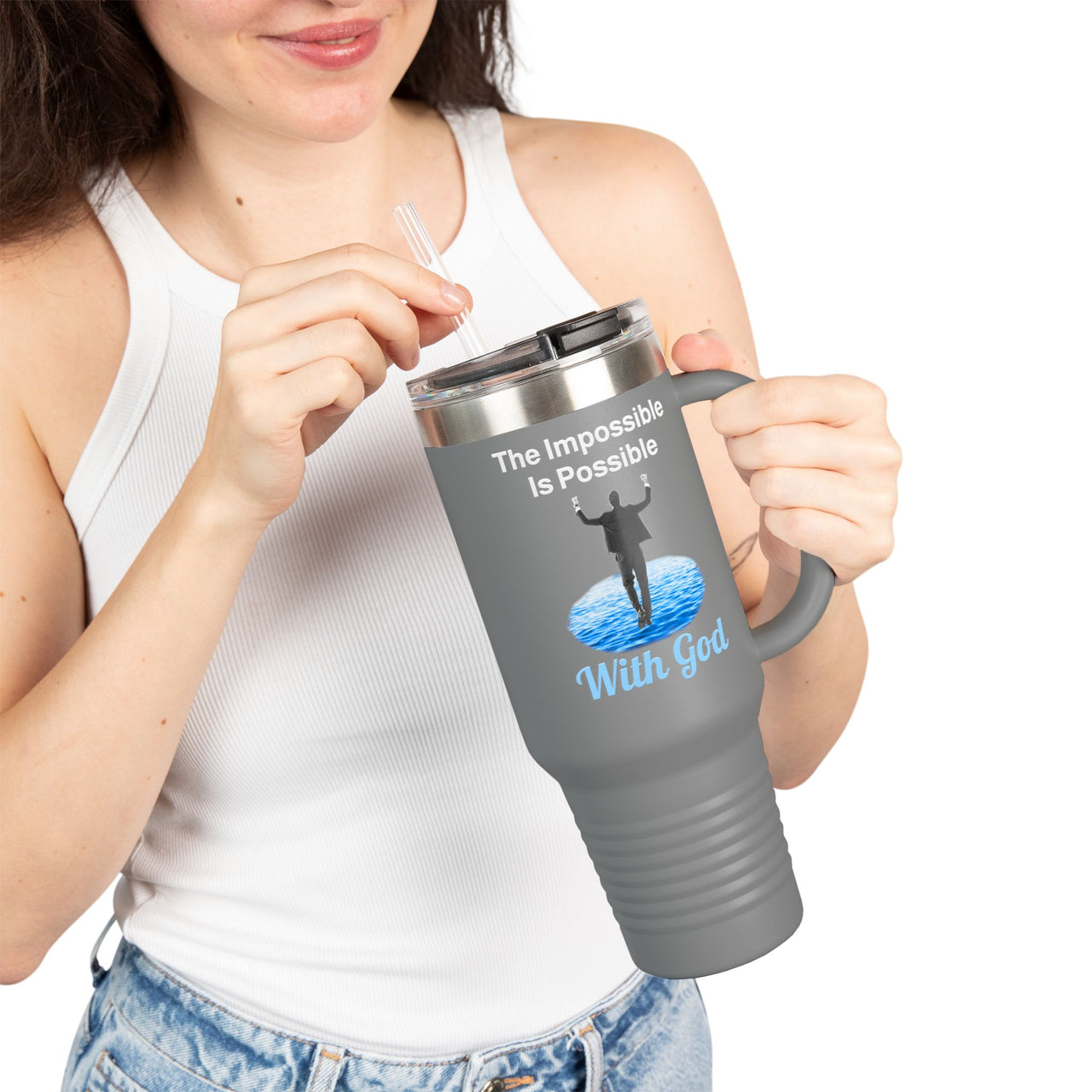 40oz inspirational travel mug with “Impossible Man” design message "The Impossible Is Possible with God," faith-based tumbler for men, stainless steel, leak-proof, double-wall insulated, girl holding gray mug