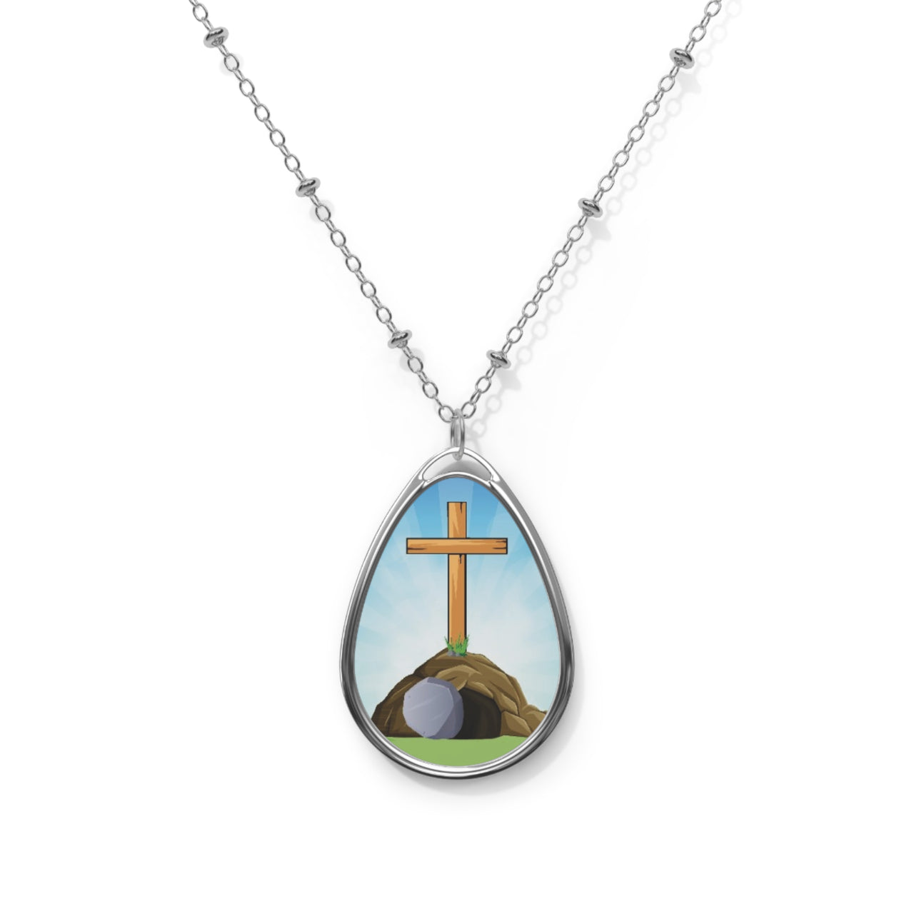 Inspirational oval pendant necklace with "He Is Risen" design, empty grave and cross artwork, zinc alloy and white aluminum, spiritual jewelry for resurrection faith, front