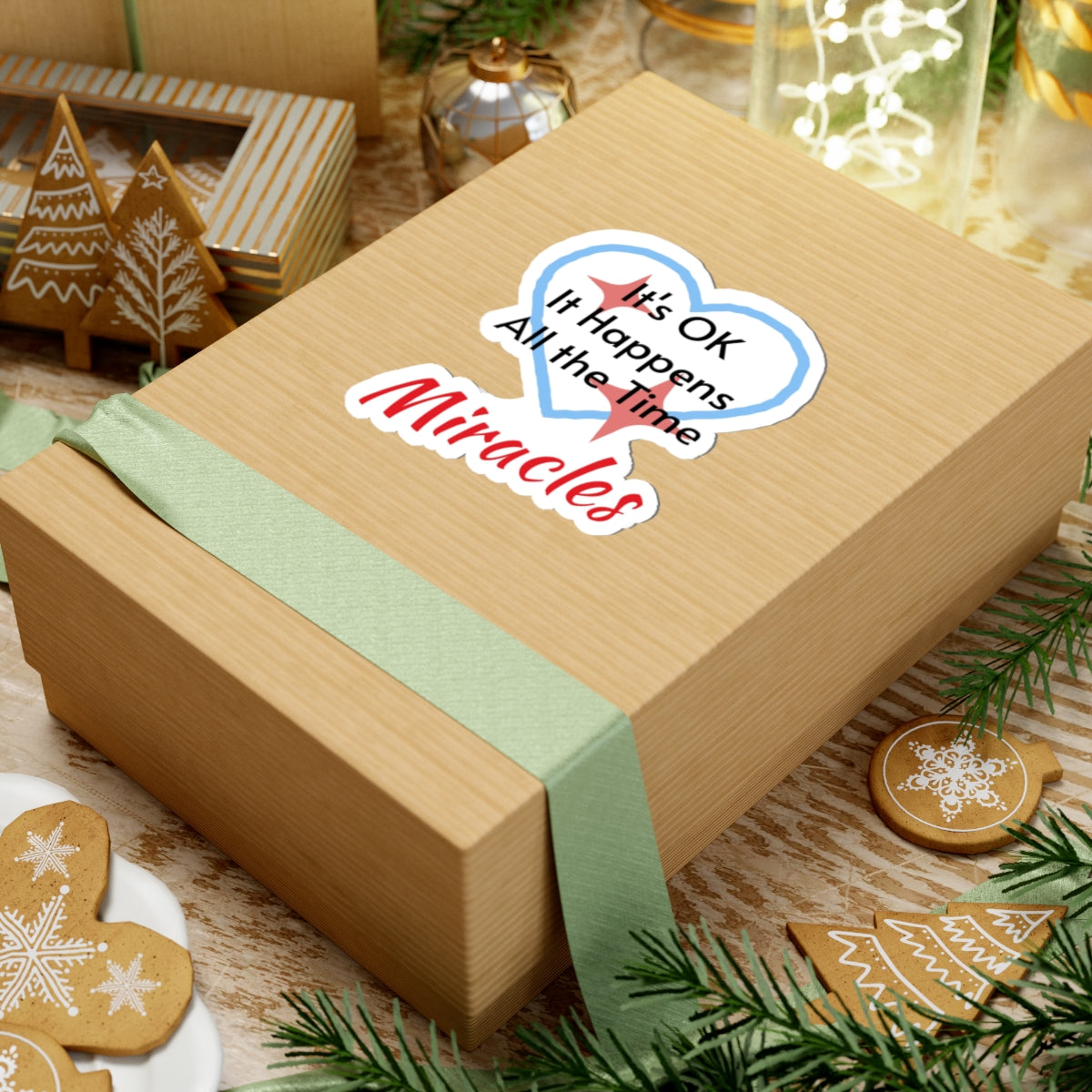 Large vinyl sticker with “Miracles Happen” design, message “It’s OK. It Happens All the Time – Miracles,” glossy finish, faith-based sticker are daily reminders of God’s tangible goodness, 4-inch sticker on gift box
