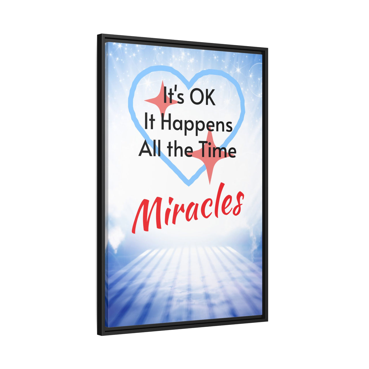 Framed canvas wall art with “Miracles Happen” design, inspirational message "It's OK, It Happens All the Time - Miracles," black pinewood frame, coated cotton-poly canvas, ready to hang, 24x36 framed wall art view 1