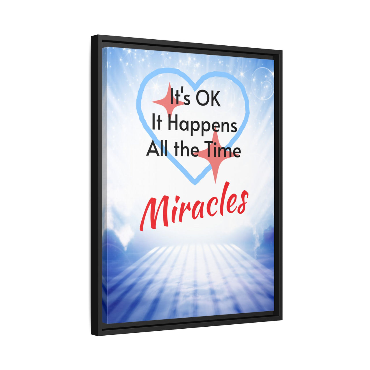 Framed canvas wall art with “Miracles Happen” design, inspirational message "It's OK, It Happens All the Time - Miracles," black pinewood frame, coated cotton-poly canvas, ready to hang, 18x24 framed wall art