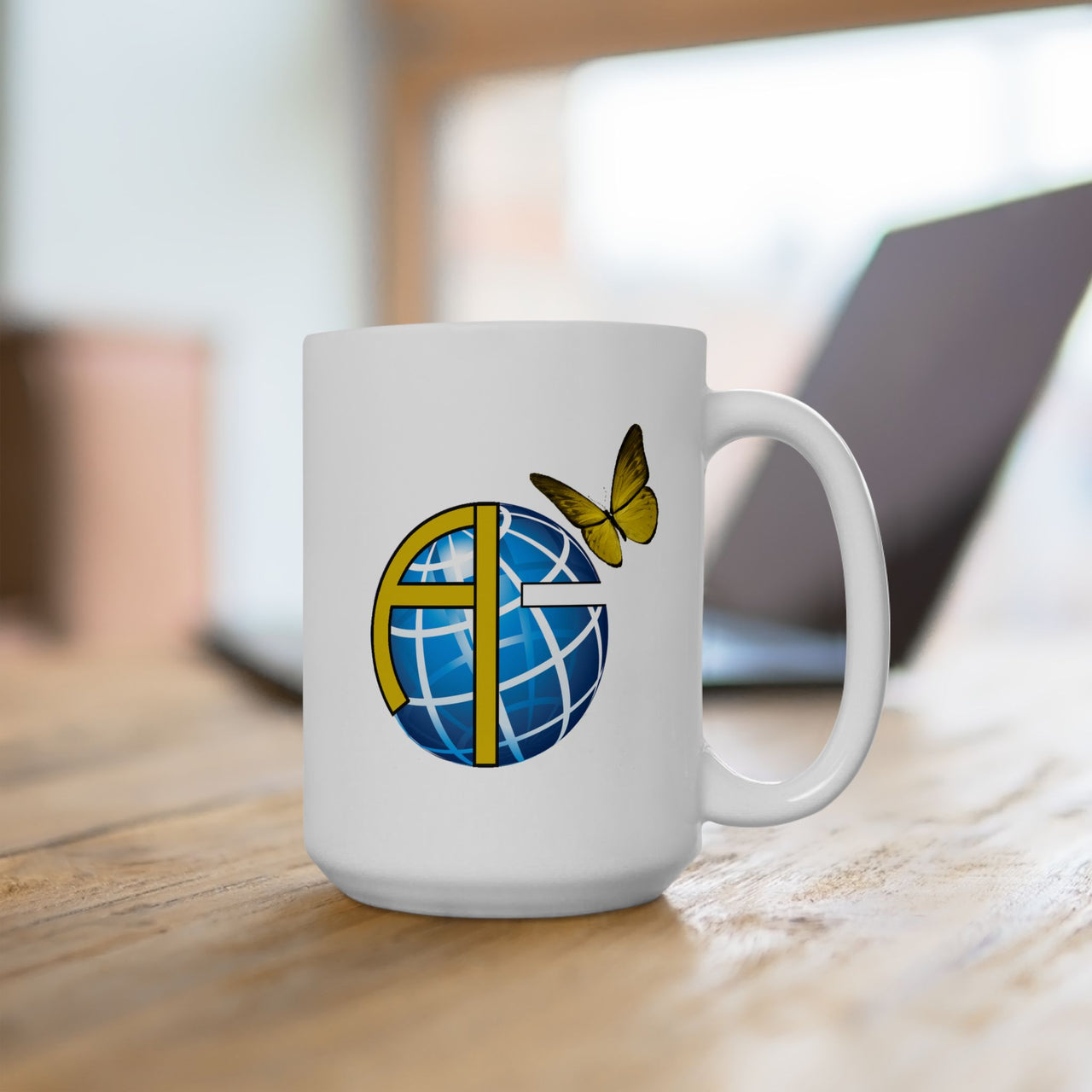 Ceramic mug with Anakainoo International logo, ministry support gift, spiritual transformation message, microwave safe, 11oz and 15oz, 15oz mug on table