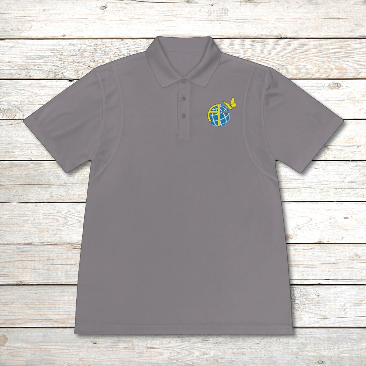 Men’s Sport-Tek polo shirt with Anakainoo International logo, moisture-wicking polyester with globe and butterfly design symbolizing spiritual renewal and transformation through intimacy with God, gray polo shirt