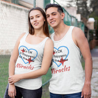 Lightweight Bella+Canvas tank top made from preshrunk cotton with “Miracles Happen” design message, “It’s OK. It Happens All the Time – Miracles,” inspirational apparel encouraging daily miracles through intimacy with God, couple wearing matching white tank tops