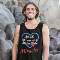 Lightweight Bella+Canvas tank top made from preshrunk cotton with “Miracles Happen” design message, “It’s OK. It Happens All the Time – Miracles,” inspirational apparel encouraging daily miracles through intimacy with God, man smiling by the rocks in black tank top