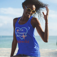 Lightweight Bella+Canvas tank top made from preshrunk cotton with “Miracles Happen” design message, “It’s OK. It Happens All the Time – Miracles,” inspirational apparel encouraging daily miracles through intimacy with God, woman at beach wearing blue tank top