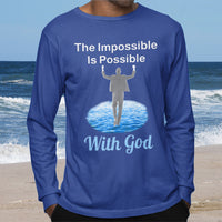 Long-sleeve Bella+Canvas t-shirt made from preshrunk ring-spun cotton with “Impossible Man” design message, “The Impossible Is Possible with God,” inspirational apparel calling believers to step out in faith and trust God for more than they can ask or imagine, man wearing blue long-sleeve t-shirt