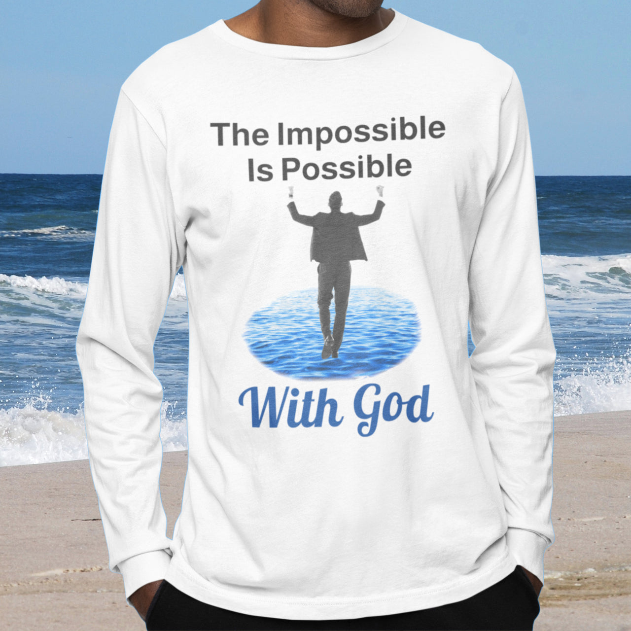 Long-sleeve Bella+Canvas t-shirt made from preshrunk ring-spun cotton with “Impossible Man” design message, “The Impossible Is Possible with God,” inspirational apparel calling believers to step out in faith and trust God for more than they can ask or imagine, man wearing white long-sleeve t-shirt