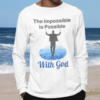 Long-sleeve Bella+Canvas t-shirt made from preshrunk ring-spun cotton with “Impossible Man” design message, “The Impossible Is Possible with God,” inspirational apparel calling believers to step out in faith and trust God for more than they can ask or imagine, man wearing white long-sleeve t-shirt
