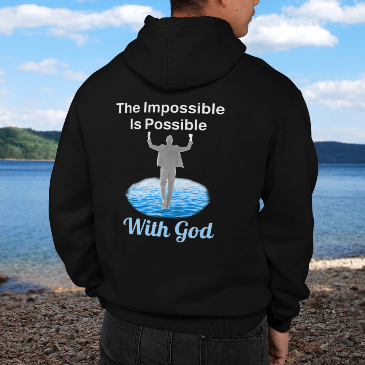 Gildan unisex zip-up hoodie with “Impossible Man” design featuring a man walking on water and uplifting message, Christian apparel made from soft cotton-poly fleece, perfect for cold weather and spiritual encouragement, man in black hoodie