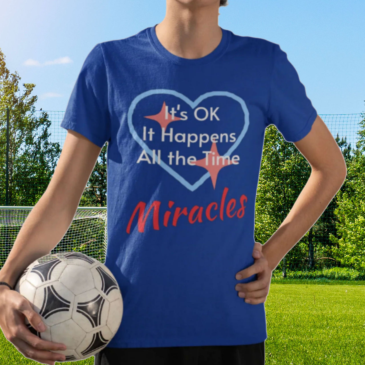 Bella+Canvas youth unisex t-shirt with “Miracles Happen” design and uplifting message, Christian apparel made from soft cotton, ideal for active kids and faith-inspired everyday wear, boy in blue t-shirt