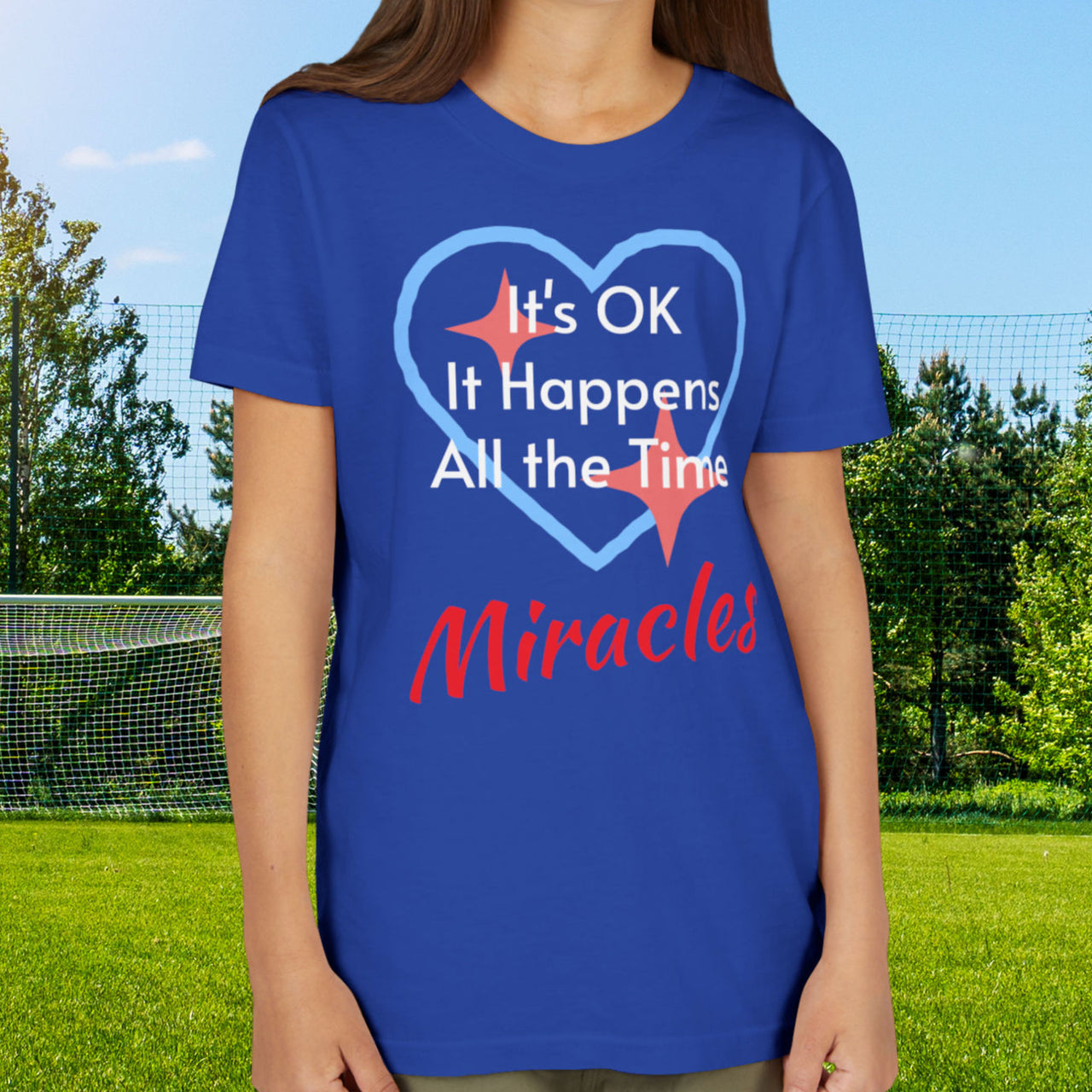 Bella+Canvas youth unisex t-shirt with “Miracles Happen” design and uplifting message, Christian apparel made from soft cotton, ideal for active kids and faith-inspired everyday wear, girl in blue t-shirt