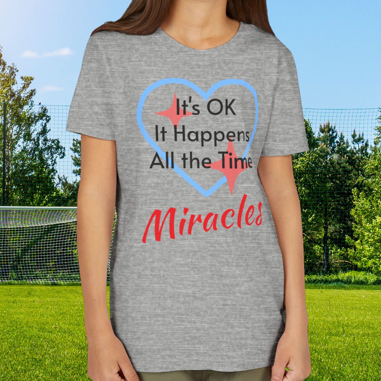 Bella+Canvas youth unisex t-shirt with “Miracles Happen” design and uplifting message, Christian apparel made from soft cotton, ideal for active kids and faith-inspired everyday wear, girl in gray t-shirt