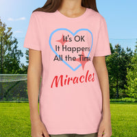 Bella+Canvas youth unisex t-shirt with “Miracles Happen” design and uplifting message, Christian apparel made from soft cotton, ideal for active kids and faith-inspired everyday wear, girl in pink t-shirt