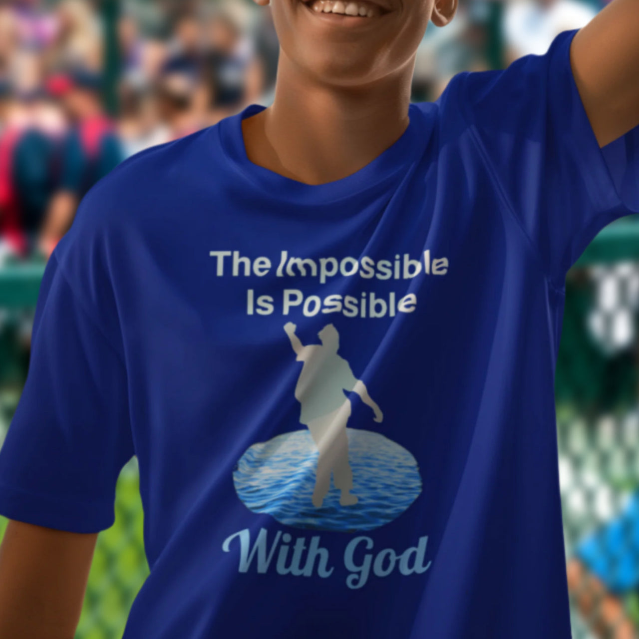 Bella+Canvas youth unisex t-shirt with “Impossible Teen” design featuring a teen walking on water and uplifting message, Christian apparel made from soft cotton, perfect for active wear and spiritual encouragement, boy in blue t-shirt