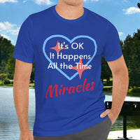 Soft, breathable Bella+Canvas t-shirt made from preshrunk cotton with “Miracles Happen” design message, “It’s OK. It Happens All the Time – Miracles,” inspirational shirt encouraging intimacy with God that produces everyday miracles, man in blue shirt