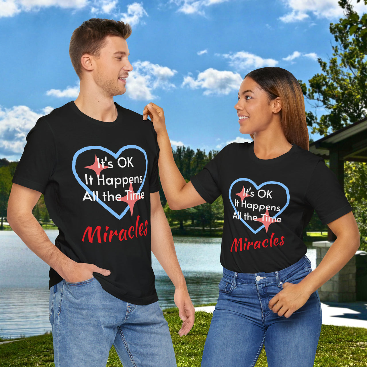 Soft, breathable Bella+Canvas t-shirt made from preshrunk cotton with “Miracles Happen” design message, “It’s OK. It Happens All the Time – Miracles,” inspirational shirt encouraging intimacy with God that produces everyday miracles, couple wearing black t-shirts