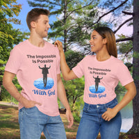 Soft, breathable Bella+Canvas t-shirt made from preshrunk cotton with “Impossible Man” design message, “The Impossible Is Possible with God,” inspirational shirt encouraging bold faith to step out and follow God into the impossible, couple in matching pink t-shirts