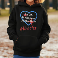 Gildan youth unisex hoodie with “Miracles Happen” design and uplifting message, Christian apparel made from soft preshrunk fleece, ideal for cooler weather and faith-inspired comfort, boy in black hoodie