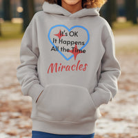Gildan youth unisex hoodie with “Miracles Happen” design and uplifting message, Christian apparel made from soft preshrunk fleece, ideal for cooler weather and faith-inspired comfort, boy in gray hoodie