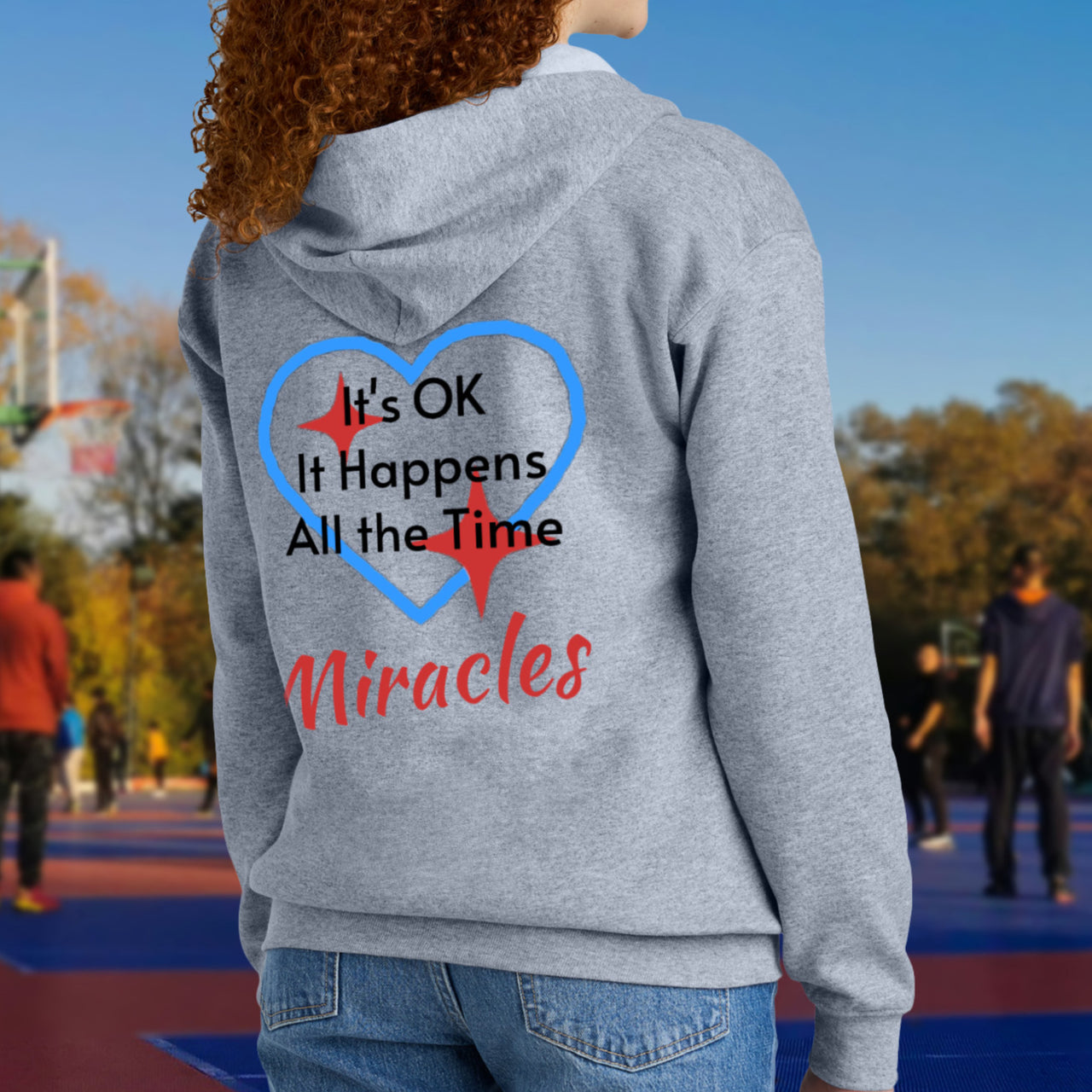 Gildan youth zip-up hoodie with “Miracles Happen” design and uplifting message, Christian apparel made from soft preshrunk fleece, ideal for cooler weather and faith-inspired comfort, teen in gray hoodie