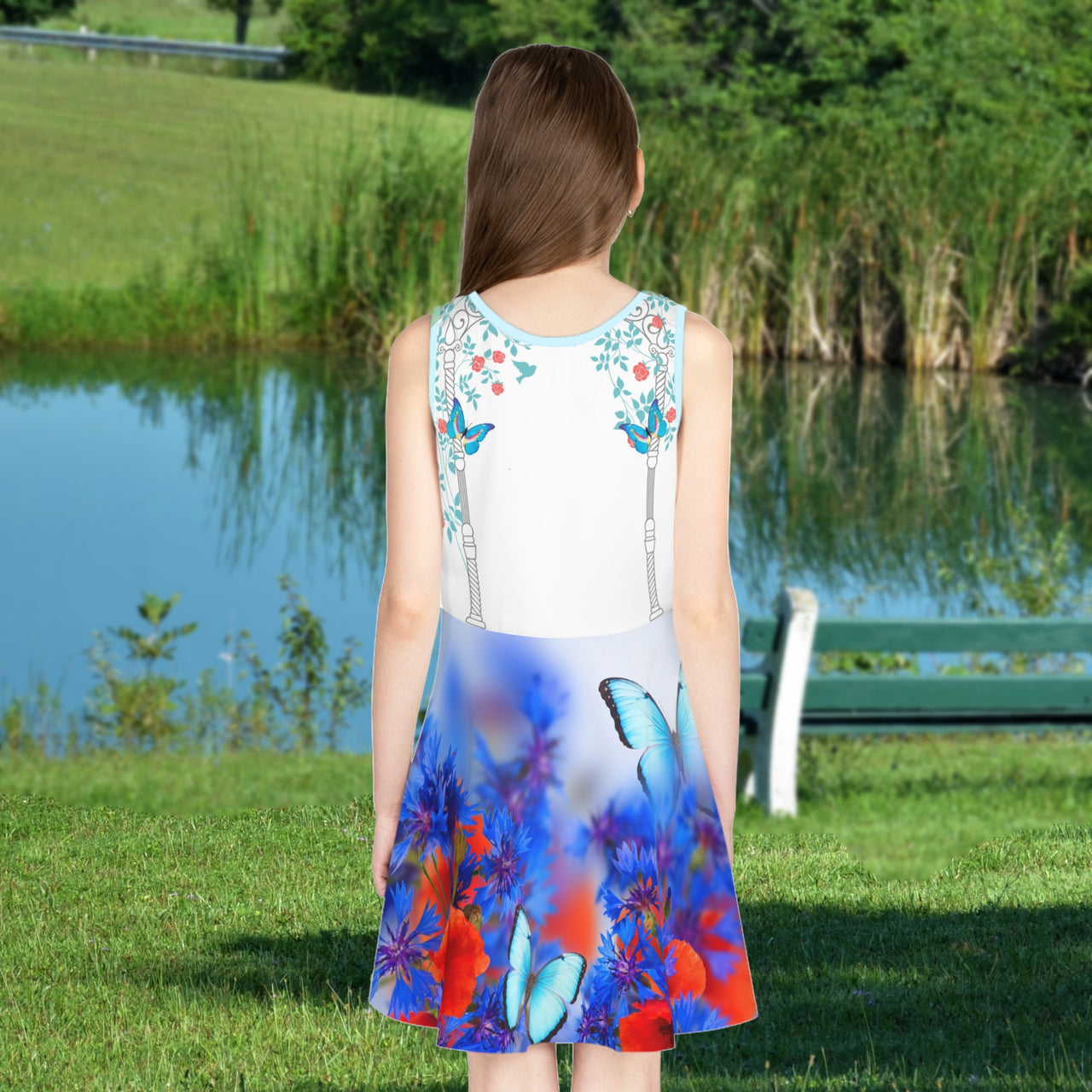 Blue girls’ sundress with butterfly and flower design, “I love you” message, part of Paisley’s Corner Collection, lightweight polyester-spandex blend, ideal for summer and special occasions, girl in butterfly sundress - back view