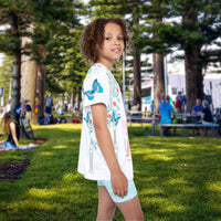 Girls’ butterfly sports jersey with colorful flower design and “I love you” message, moisture-wicking polyester, part of Paisley’s Corner Collection, ideal for school and active wear, girl in butterfly garden top - right view