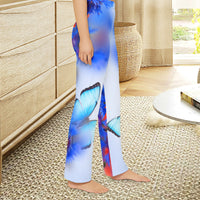 Girls’ butterfly lounge pants with blue butterfly and garden design, soft brushed polyester, elastic waistband, part of Paisley’s Corner Collection, ideal for sleepovers and cozy home wear, girl in butterfly lounge pants - right side view