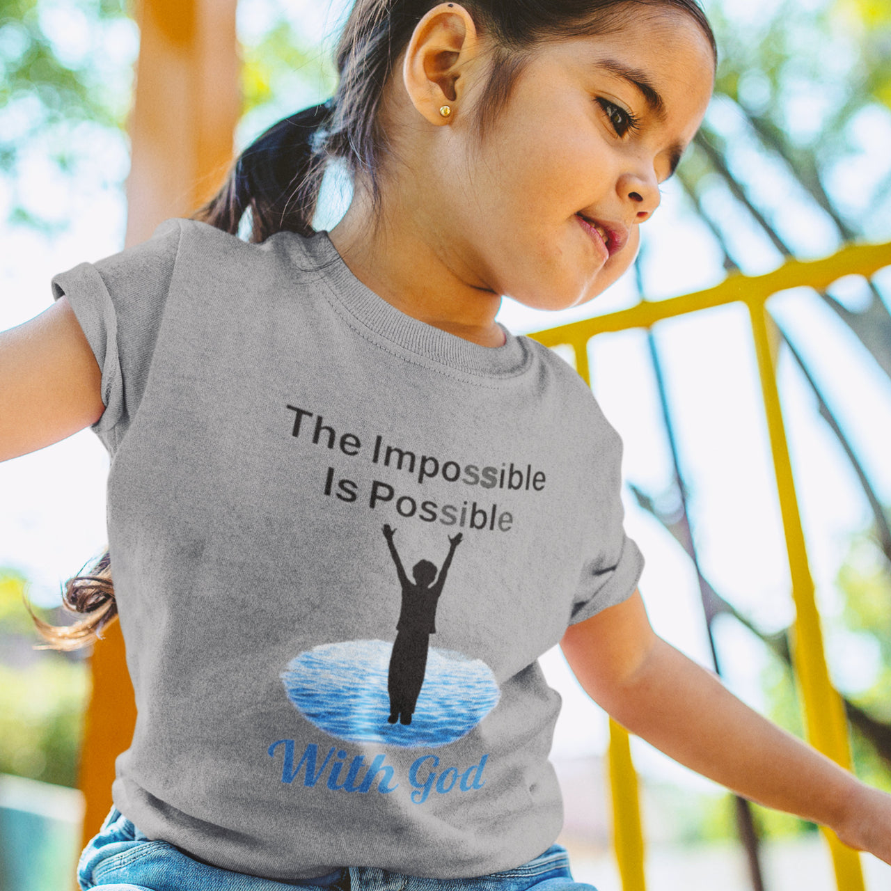 Bella+Canvas toddler t-shirt with “Impossible Toddler” design and faith-filled message, soft cotton, breathable and durable, Christian apparel for active toddlers and family matching, toddler girl in gray t-shirt