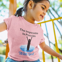 Bella+Canvas toddler t-shirt with “Impossible Toddler” design and faith-filled message, soft cotton, breathable and durable, Christian apparel for active toddlers and family matching, toddler girl in pink t-shirt