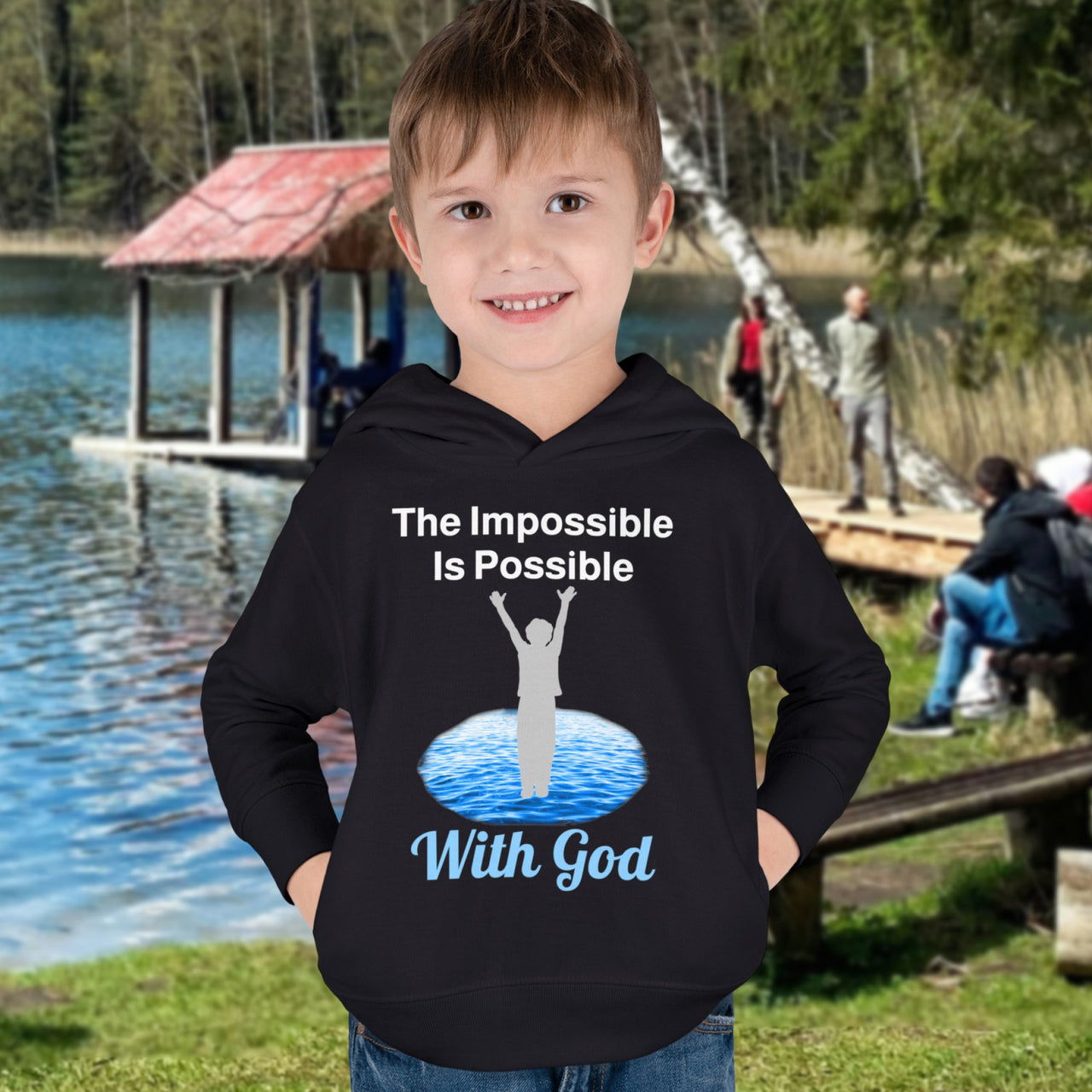 Rabbit Skins toddler fleece hoodie with “Impossible Toddler” design and faith-filled message, soft cotton-poly blend, durable stitching, Christian apparel for active toddlers and spiritual encouragement, toddler boy in black hoodie