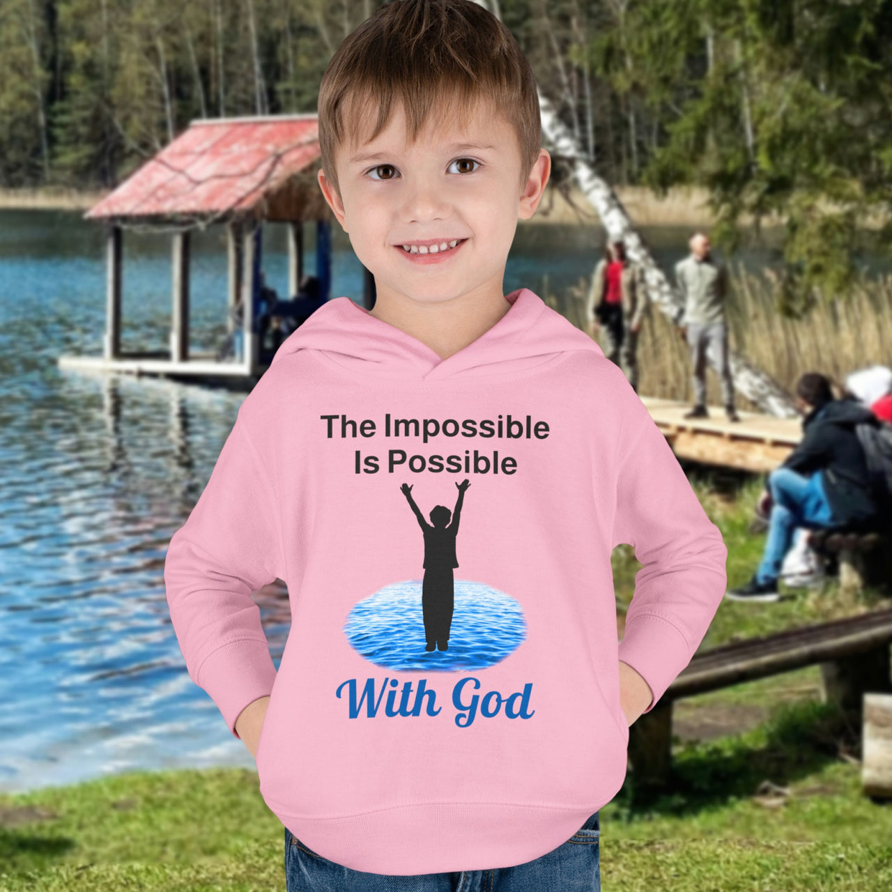 Rabbit Skins toddler fleece hoodie with “Impossible Toddler” design and faith-filled message, soft cotton-poly blend, durable stitching, Christian apparel for active toddlers and spiritual encouragement, toddler boy in pink hoodie