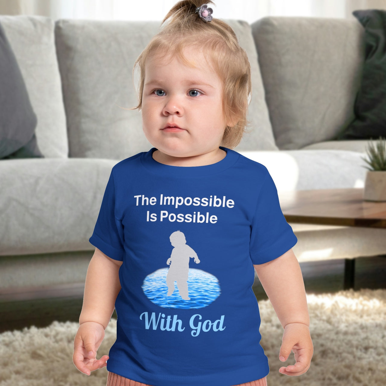 Bella+Canvas baby t-shirt with “Impossible Baby” design and faith-filled message, soft cotton, breathable and durable, Christian apparel for infants and family matching, baby in blue shirt