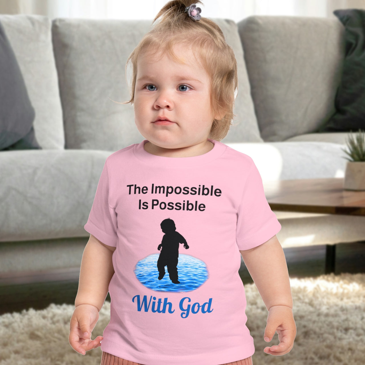 Bella+Canvas baby t-shirt with “Impossible Baby” design and faith-filled message, soft cotton, breathable and durable, Christian apparel for infants and family matching, baby in pink shirt