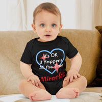 Bella+Canvas baby onesie with “Miracles Happen” design and uplifting message, soft cotton, envelope neck and snap closure, Christian apparel for infants and family matching, baby boy in black onesie