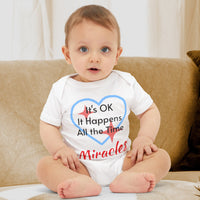 Bella+Canvas baby onesie with “Miracles Happen” design and uplifting message, soft cotton, envelope neck and snap closure, Christian apparel for infants and family matching, baby boy in white onesie