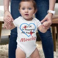 Bella+Canvas baby onesie with “Miracles Happen” design and uplifting message, soft cotton, envelope neck and snap closure, Christian apparel for infants and family matching, baby girl in white onesie