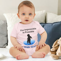 Bella+Canvas baby onesie with “Impossible Baby” design and faith-filled message, soft cotton, envelope neck and snap closure, Christian apparel for infants and spiritual encouragement, baby boy in pink onesie