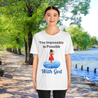 Soft, breathable Bella+Canvas t-shirt made from preshrunk cotton with “Impossible Woman” design message, “The Impossible Is Possible with God,” inspirational shirt encouraging bold obedience and faith-filled movement with God, 2nd woman in white t-shirt on waterside walkway