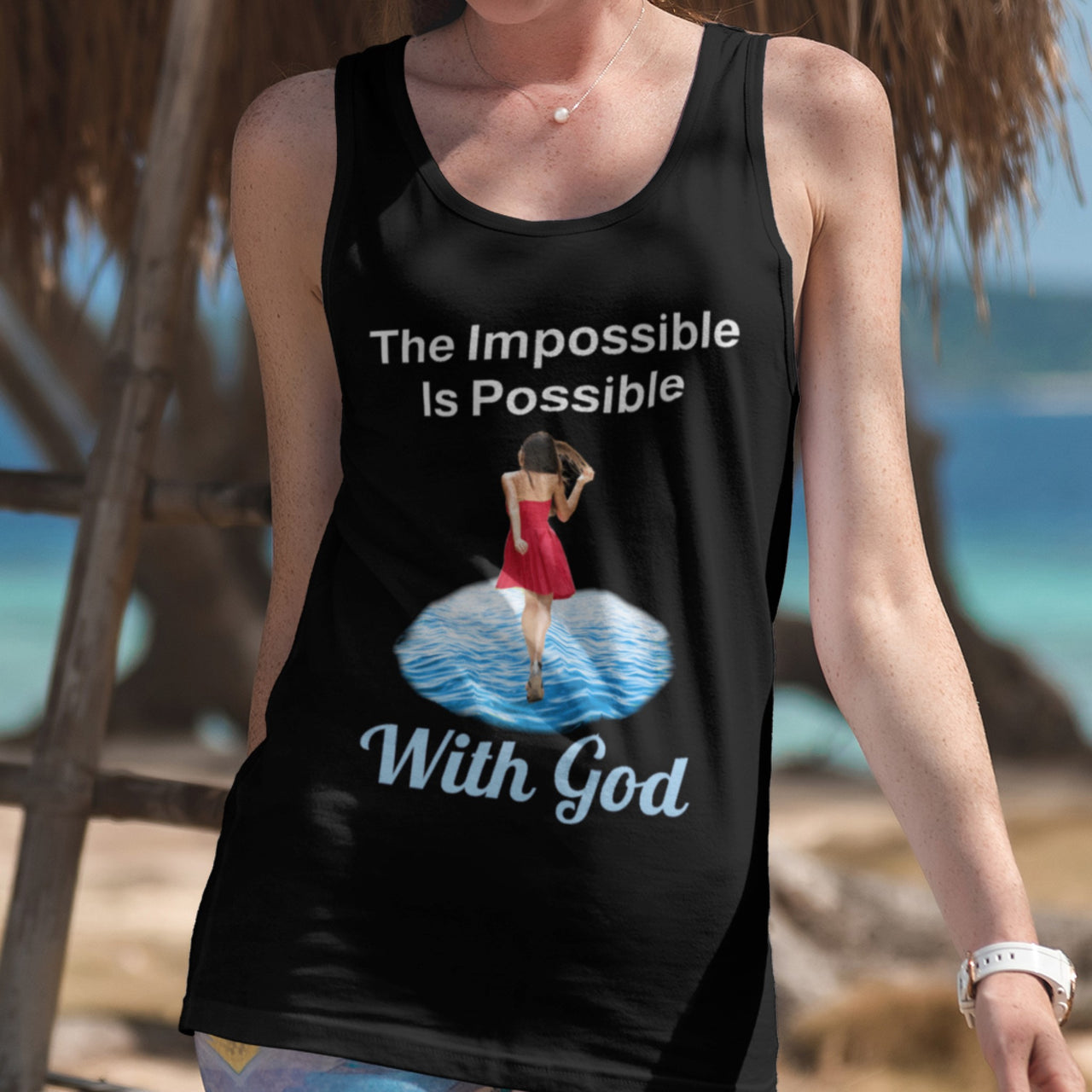 Lightweight Bella+Canvas tank top made from preshrunk cotton with “Impossible Woman” design message, “The Impossible Is Possible with God,” inspirational apparel encouraging women to walk in step with God who makes our impossible dreams become real, woman wearing black tank top