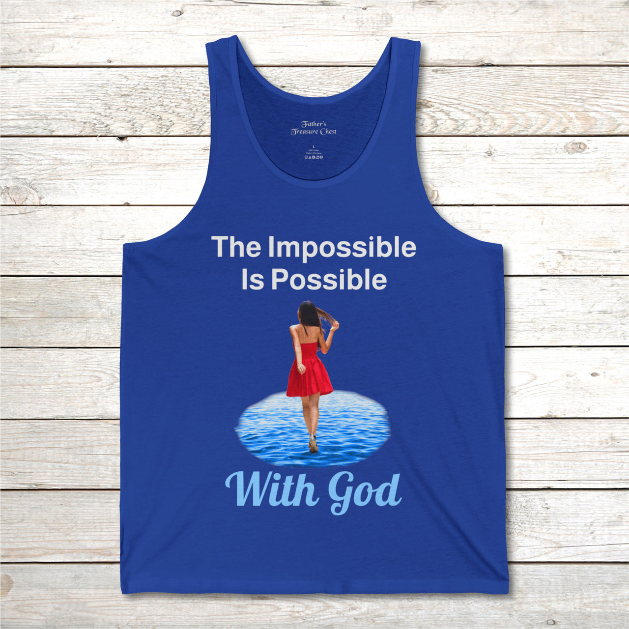 Lightweight Bella+Canvas tank top made from preshrunk cotton with “Impossible Woman” design message, “The Impossible Is Possible with God,” inspirational apparel encouraging women to walk in step with God who makes our impossible dreams become real, front of blue tank top
