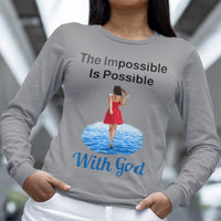 Long-sleeve Bella+Canvas t-shirt made from preshrunk ring-spun cotton with “Impossible Woman” design message, “The Impossible Is Possible with God,” inspirational apparel encouraging women to walk freely in God's incredible ways, woman wearing gray long-sleeve t-shirt