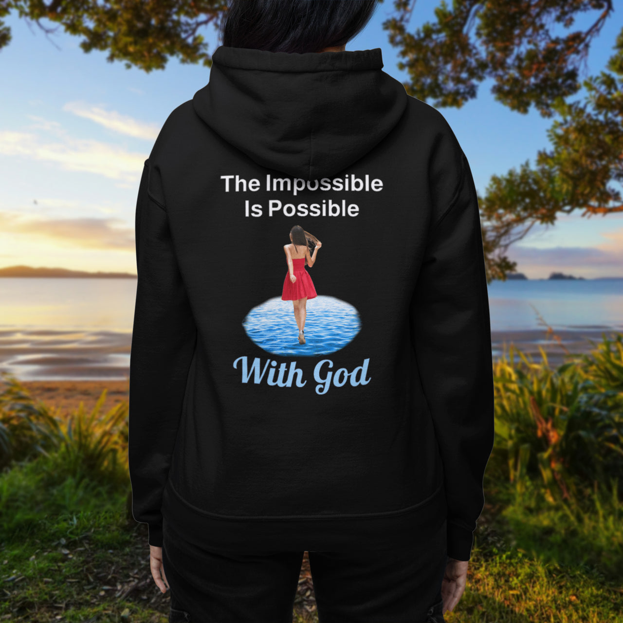 Gildan unisex zip-up hoodie with “Impossible Woman” design featuring a woman walking on water and uplifting message, Christian apparel made from soft cotton-poly fleece, ideal for cooler weather and faith-forward style, woman in black hoodie