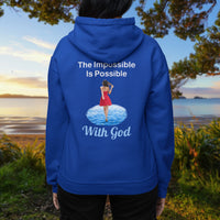 Gildan unisex zip-up hoodie with “Impossible Woman” design featuring a woman walking on water and uplifting message, Christian apparel made from soft cotton-poly fleece, ideal for cooler weather and faith-forward style, woman in blue hoodie