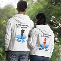 Gildan unisex zip-up hoodie with “Impossible Woman” design featuring a woman walking on water and uplifting message, Christian apparel made from soft cotton-poly fleece, ideal for cooler weather and faith-forward style, couple in white hoodie