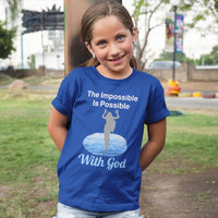 Bella+Canvas youth unisex t-shirt with “Impossible Girl” design featuring a girl walking on water and uplifting message, Christian apparel made from soft cotton, ideal for active wear and faith-forward style, young girl in blue t-shirt