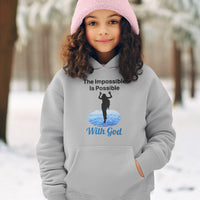 Gildan youth unisex hoodie with “Impossible Girl” design featuring a girl walking on water and uplifting message, Christian apparel made from soft preshrunk fleece, ideal for cooler weather and faith-forward style, girl in gray hoodie