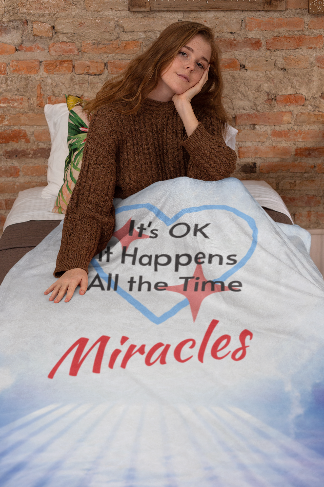 Inspirational plush blanket with “Miracles Happen” design and message "It's OK, It Happens All the Time - Miracles, soft velveteen fabric, faith-based home décor, full print front, white back, throw and twin sizes, plush throw blanket concept