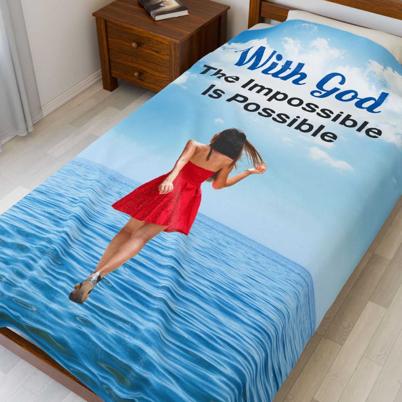 Inspirational plush blanket with “Impossible Woman” design, woman walking on water,  inspirational message "With God, The Impossible Is Possible," faith-based comfort gift, velveteen fabric, full print front, white back, throw and twin sizes, twin size on bed