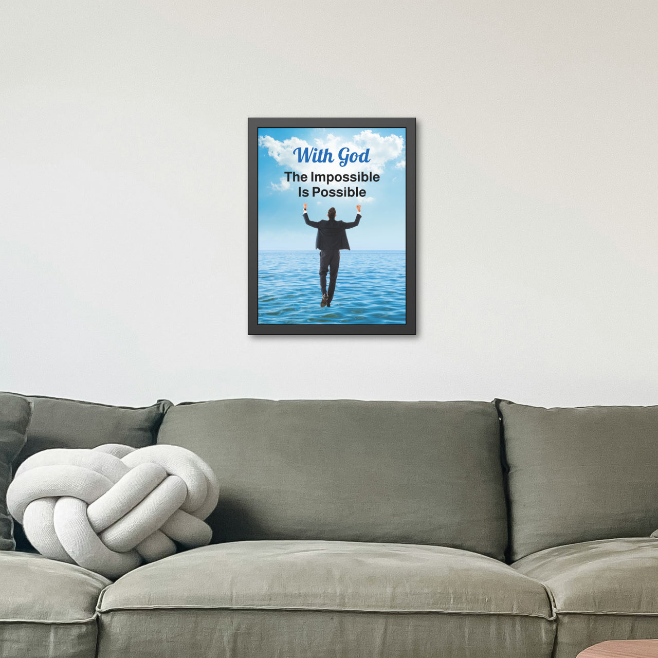Black wood framed inspirational poster with “Impossible Man” design, man walking on water with the message "With God, The Impossible Is Possible," semi-gloss finish, shatter-proof plexiglass, available in 3 sizes, 18x24 framed poster on wall